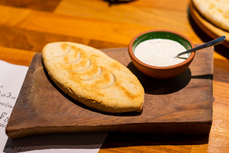 Mchadi, cornbread with souse on the wooden boardの写真素材