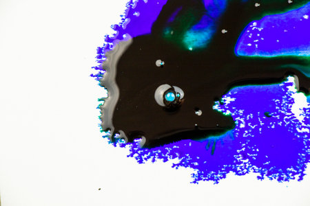 Blue color ink paint on the white backgroundの写真素材