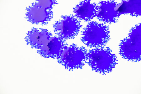 Blue color ink paint on the white backgroundの写真素材
