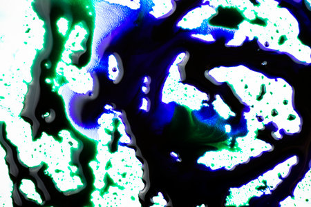 Blue color ink paint on the white backgroundの写真素材