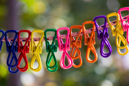 Colorful clothespins background in yardの写真素材