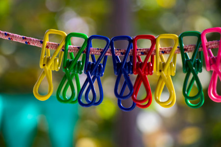 Colorful clothespins background in yardの写真素材