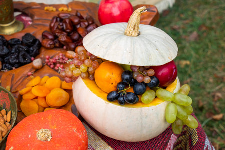Fruits and nuts on the table for wedding, red wine and foodの写真素材