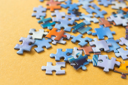 Colorful puzzles on the yellow backgroundの写真素材