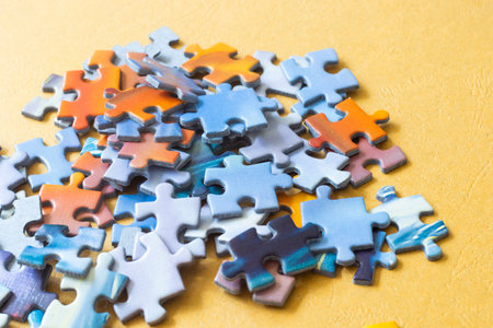 Colorful puzzles on the yellow backgroundの写真素材
