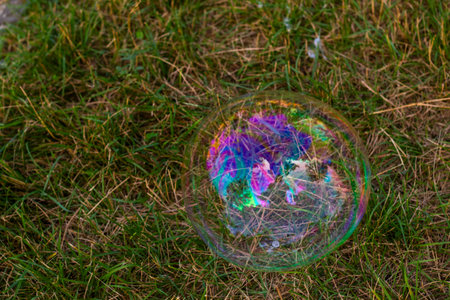 Soap bubbles in yard, colorful bubbles