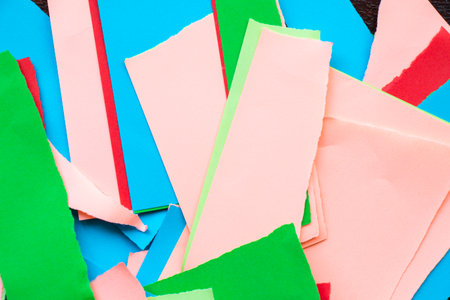 Wallpaper and background made from crumpled torn and colorful pieces of paperの写真素材