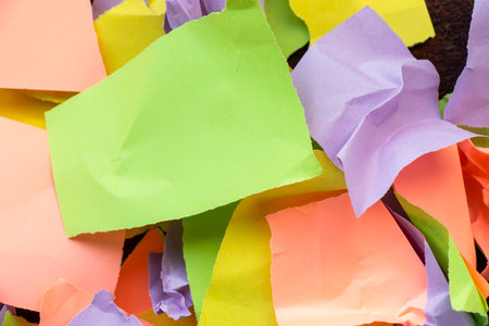 Wallpaper and background made from crumpled torn and colorful pieces of paperの写真素材
