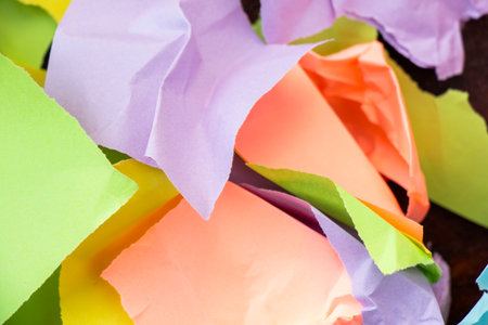 Wallpaper and background made from crumpled torn and colorful pieces of paperの写真素材