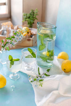 Fresh lemons lemonade in glasses with mint and rosemaryの写真素材