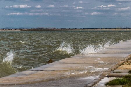 Storm over the lake with sunshine.の写真素材