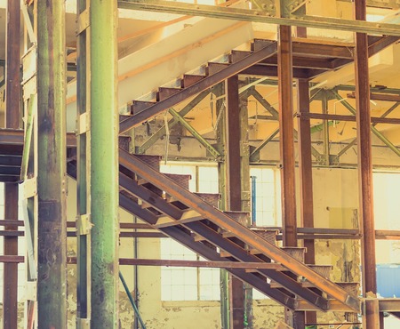 Abandoned old industrial interior stairs.の写真素材