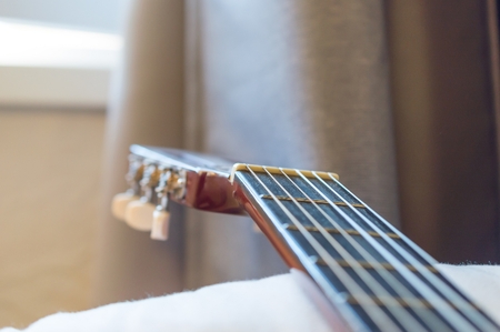 Detail of classic acoustic guitar with shallow depth of field.の写真素材