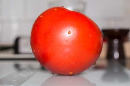 Fresh beef tomatoes in the kitchen.の写真素材