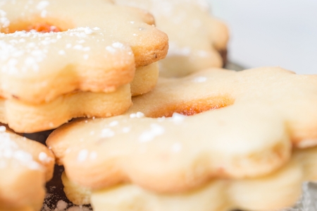 Homemade apricot jam Linzer with icing sugar close up.の写真素材
