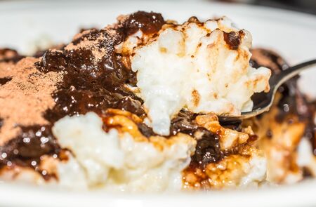 Rice milk porridge with cocoa and cherry marmaladeの写真素材