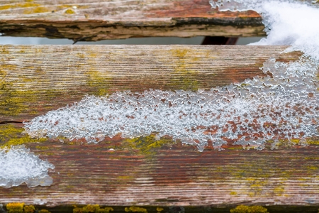 Wooden floor table or bridge covered snowの写真素材