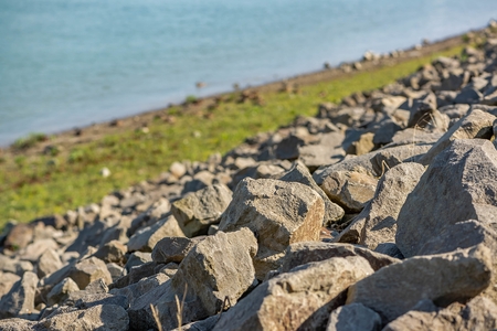 Rocks on the riverbank with sping sunshineの写真素材
