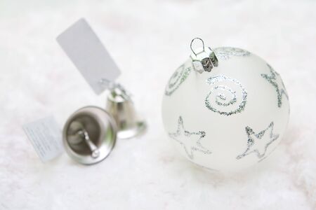Close up christmas decoration with bells on white background.の写真素材