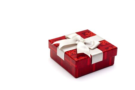 A red gift box with white ribbon, for any occasion.の写真素材