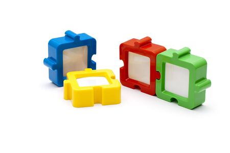 Puzzel photo frames in a row, in various colors, and isolated on white background.の写真素材
