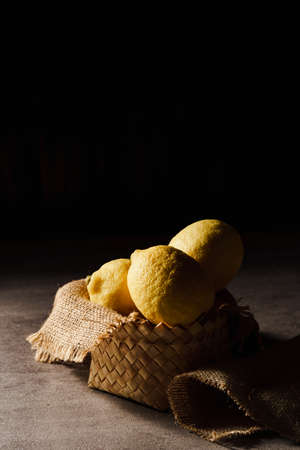 3 Lemons stacked on the tableの写真素材