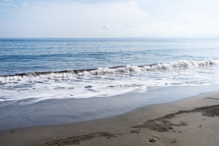 Beautiful seascape with sea waves on the sandy beach.の写真素材