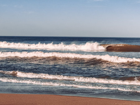 Waves smashing into waterの写真素材