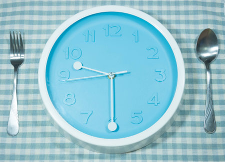 clock with spoon and fork