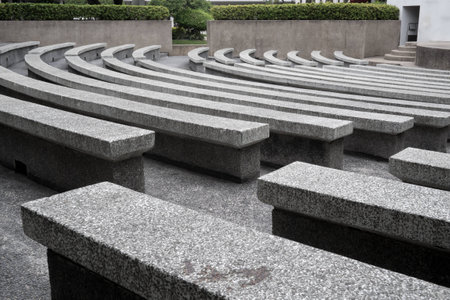 Rows of stone bench in stadium