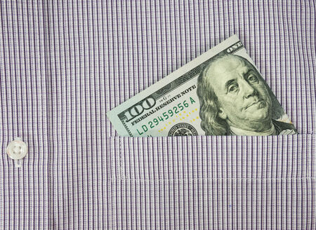 money in shirt pocket