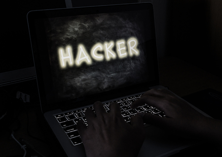 hacker with laptop on working