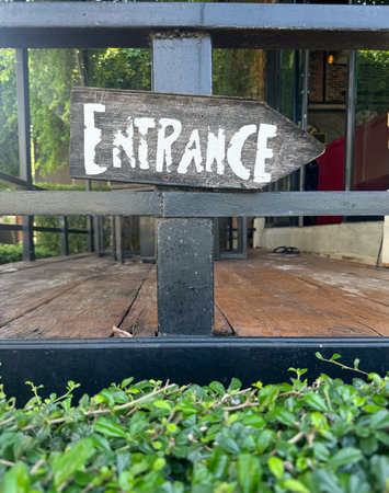 Entrance sign hanging in front of restaurant.の写真素材