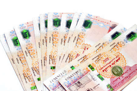 Banknotes of different denominations on a white background close-up.
