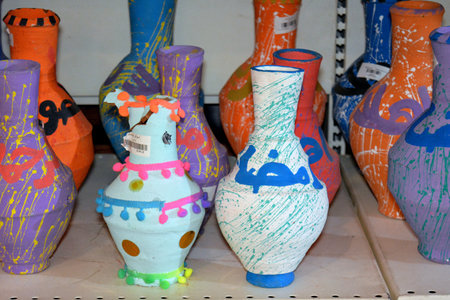 Giza, Egypt, March 14 2022: Traditional pottery water bowls with Ramadan decoration and Arabic text on it, Translation (Generous Ramadan) as a Ramadan decoration, selective focusのeditorial素材