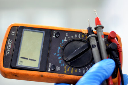 Cairo, Egypt, July 27 2023: DT9205A A digital multimeter, a test tool used to measure two or more electrical values, principally voltage (volts), current (amps) and resistance (ohms), selective focusのeditorial素材