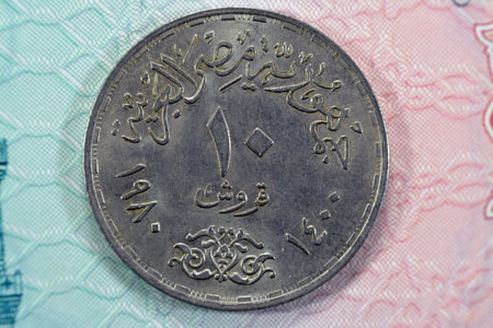 Ten Egyptian piasters 1980 AD 1400 AH commemorative of 18 March Day of the Egyptian Doctors, doctor's day Al Kasr Al Ainy with Seated healer with staff on obverse, date and value on reverseの写真素材