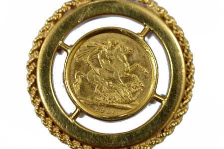 The sovereign is a British gold coin shape with a nominal value of one pound sterling, a bullion coin and is sometimes mounted in Jewellery with the design of George and the Dragon on the reverseの写真素材