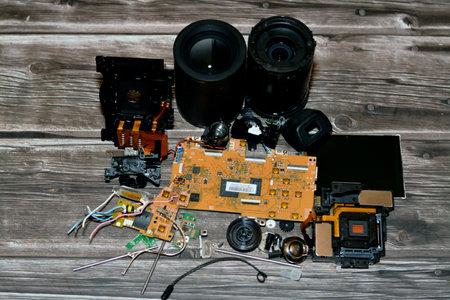 Cairo, Egypt, November 4 2022: The interior components of a compact digital photography and videography camera with electronic chip board, optical lens, sensor, LCD screen, viewfinder and cam flashのeditorial素材