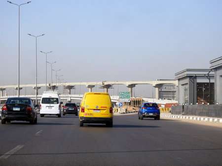 Cairo, Egypt, August 31 2023: DHL truck on its way delivering a package, DHL is the global leader in the logistics industry specializing in international shipping, courier services and transportationのeditorial素材