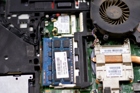 Cairo, Egypt, September 10 2023: maintenance of cooling system of a laptop, fixing a problem in a computer hardware, PC components replacement, fixation and technical support by a technicianのeditorial素材