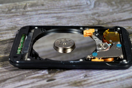 Laptop 2.5 inch hard disk drive storage memory, repair broken computer part, a close up view of an...
