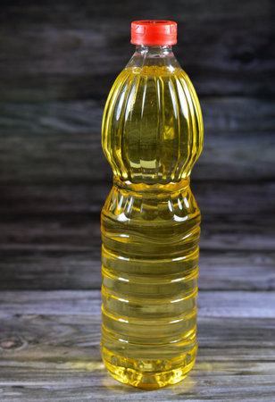 Food oil that is of mixture of sunflower, corn, soybean and natural oil that has multi uses in kitchen in cooking various food and in frying many cuisines, table oil in a bottle, selective focusの写真素材