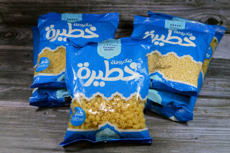 Cairo, Egypt, September 11 2023: Khatera dry raw uncooked Macaroni, dry pasta various types, made with durum wheat, selective focus of dried pasta ready to be cooked in Italian and other recipesのeditorial素材