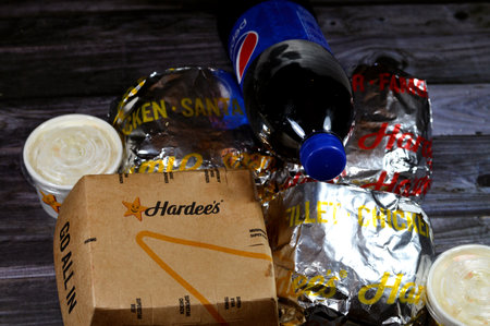 Cairo, Egypt, September 11 2023: Food delivery package of fast junk food  burger buns from Hardee's Hardees, Hardee's Restaurants LLC is an American fast-food restaurant chain operated by CKEのeditorial素材