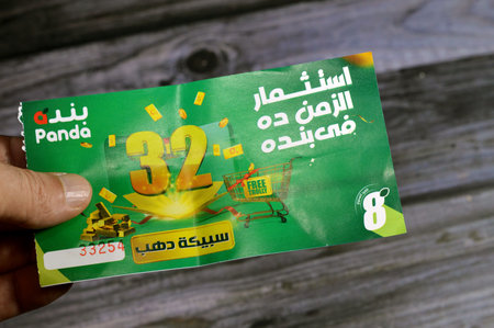 Cairo, Egypt, September 11 2023: Panda supermarket 32nd anniversary coupon for an opportunity of winning one of 32 gold bars and free trolly, the annual feast of Panda hypermarkets, A Saudi marketのeditorial素材