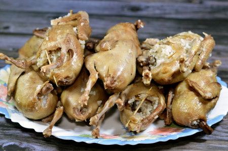 Boiled white rice stuffed pigeons or Hamam mahshi, boiled until cooked and prepared to be roasted, fried in hot oil or grilled, stuffed pigeons is a very popular Egyptian cuisine in Egyptの写真素材