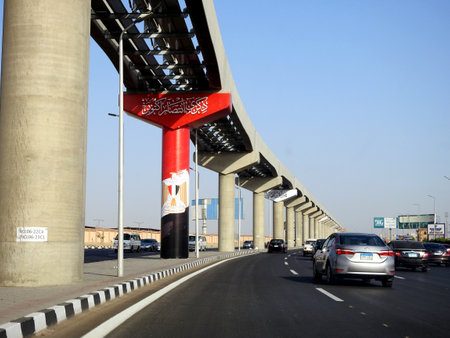 Cairo, Egypt, September 29 2023: 6th of October 1973 war victory 50th golden jubilee, Egyptian flag, national day of Egyptian victories on monorail columns, celebrations of Egypt victorious dayのeditorial素材