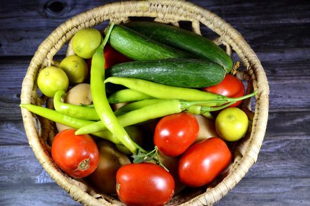 Vegetables, parts of plants that are consumed by humans or other animals as food, healthy diet, weight loss concept, pile of various vegetables, tomatoes, cucumbers, green peppers, lemons and potatoesの写真素材