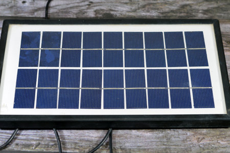 A solar panel, a device that converts sunlight into electricity by using photovoltaic (PV) cells which made of materials that generate electrons when exposed to light, to produce direct current DCの写真素材